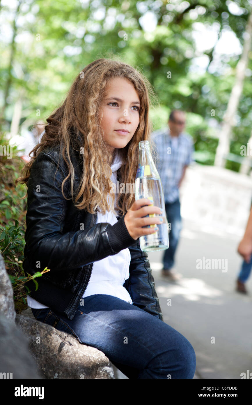 Blond child drinking water from a glass bottle Stock Photo Alamy