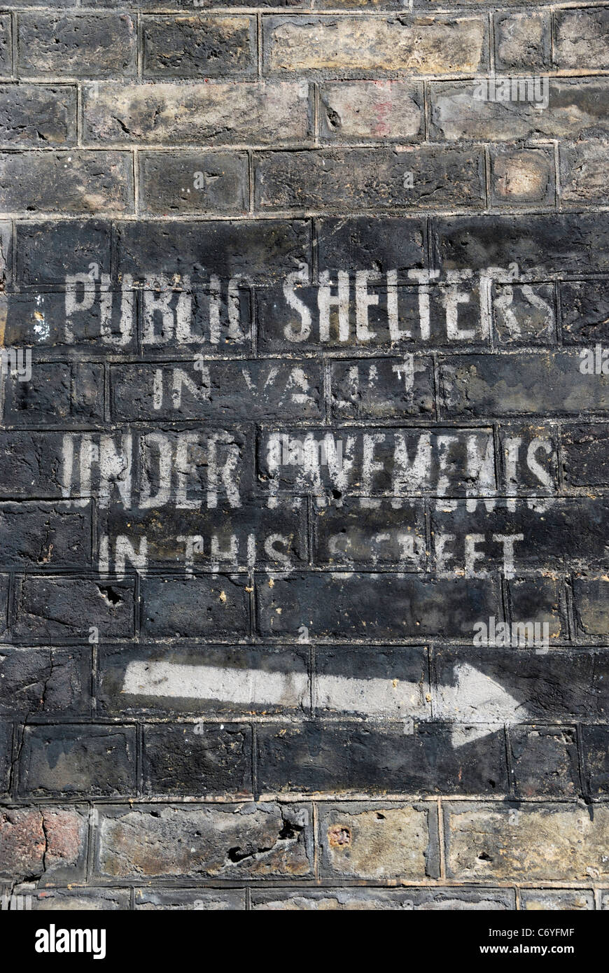 Old World War II sign indicating the presence of public air raid shelters, Lord North Street, Westminster, London, England. Stock Photo