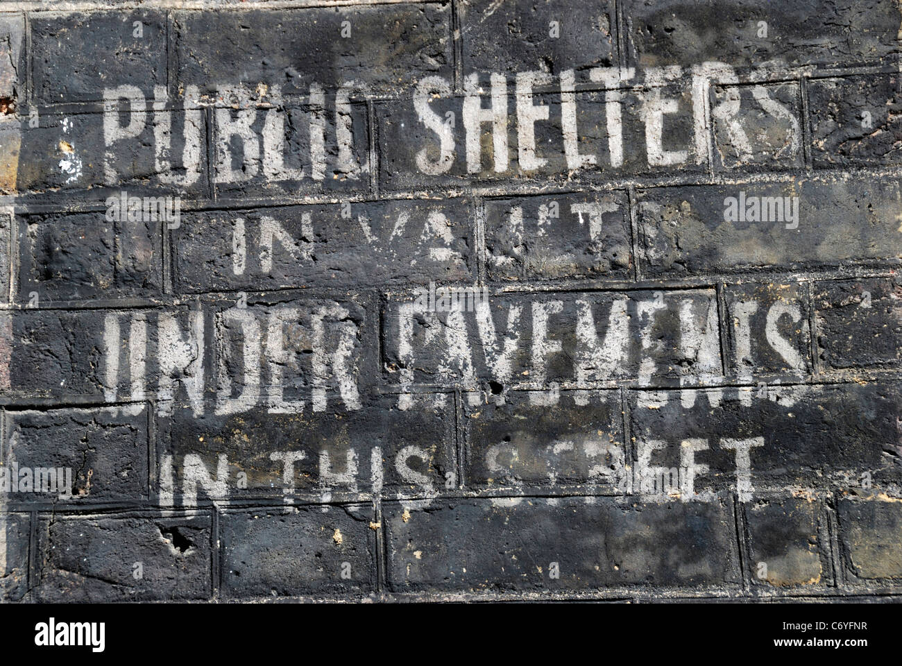 Old World War II sign indicating the presence of public air raid shelters, Lord North Street, Westminster, London, England. Stock Photo