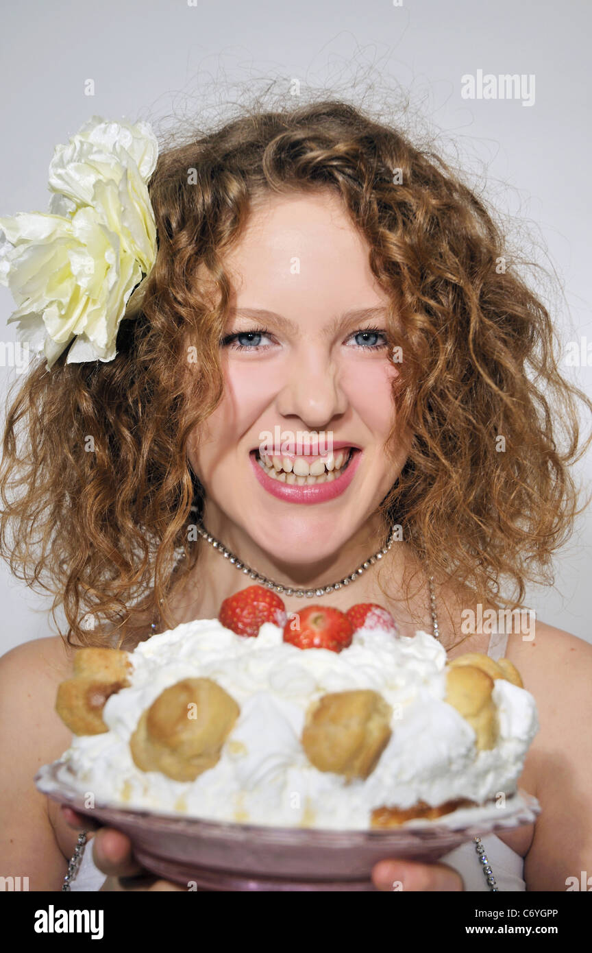 Woman holding fruit profiterole cake Stock Photo