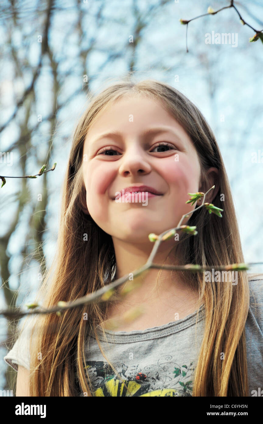 Girl smiling outdoors Stock Photo