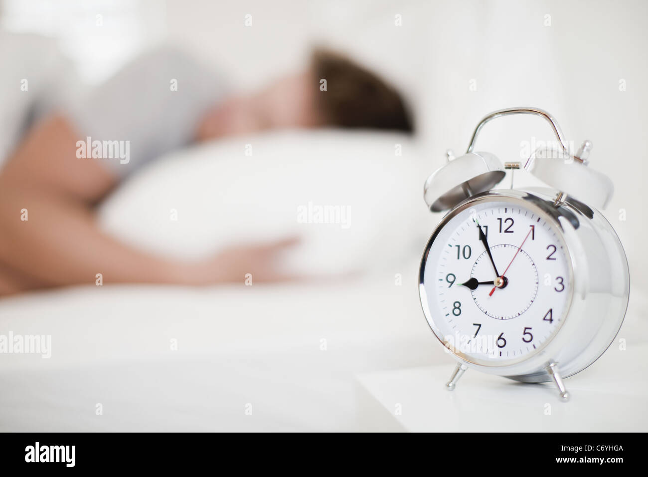 Close up of alarm clock on bedside table Stock Photo