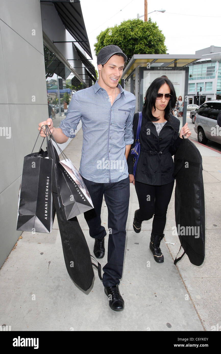 Alex Meraz and Kim Meraz 'The Twilight Saga: New Moon' actor Alex Meraz  leaving Armani Exchange after shopping with his wife Stock Photo - Alamy