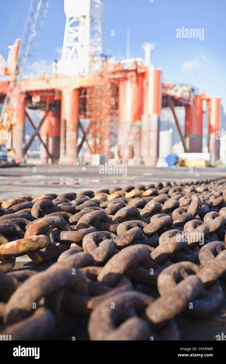 Rusted chains on oil rig Stock Photo - Alamy