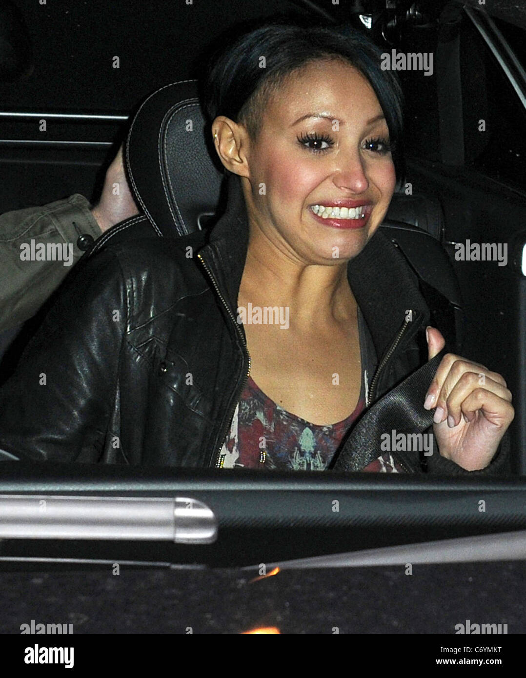 Sugarbabes singer Amelle Berrabah in a Mercedes sports car with her male companion in Soho London, England - 31.03.10 Stock Photo