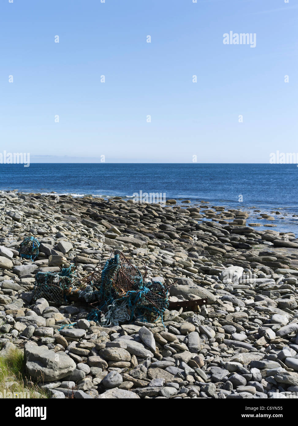 dh PAPA WESTRAY ORKNEY Lobster crab creels damaged flotsam stoney beach litter scotland rubbish discarded waste seashore garbage uk Stock Photo