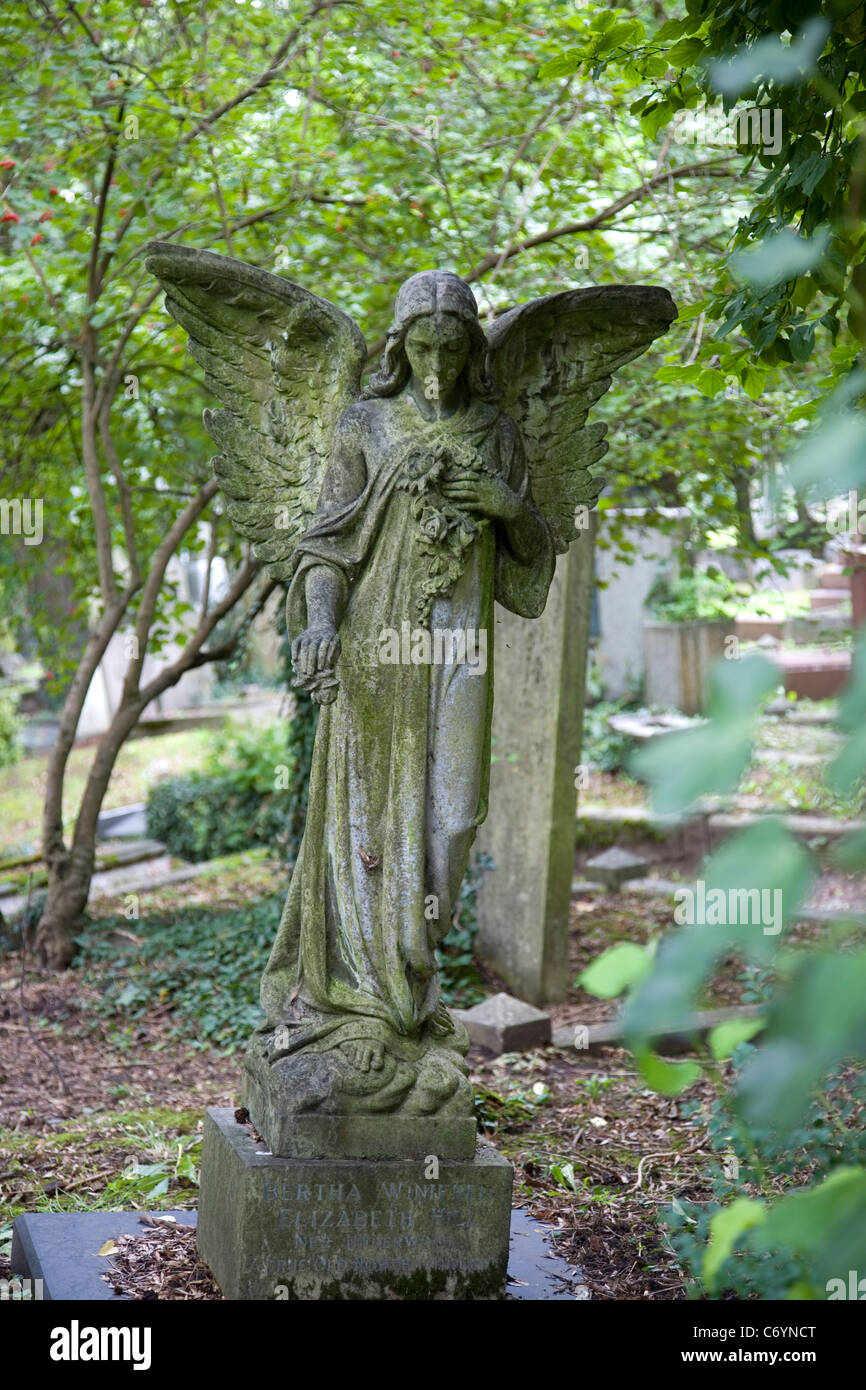 Stone female angel in Highgate Cemetery Stock Photo