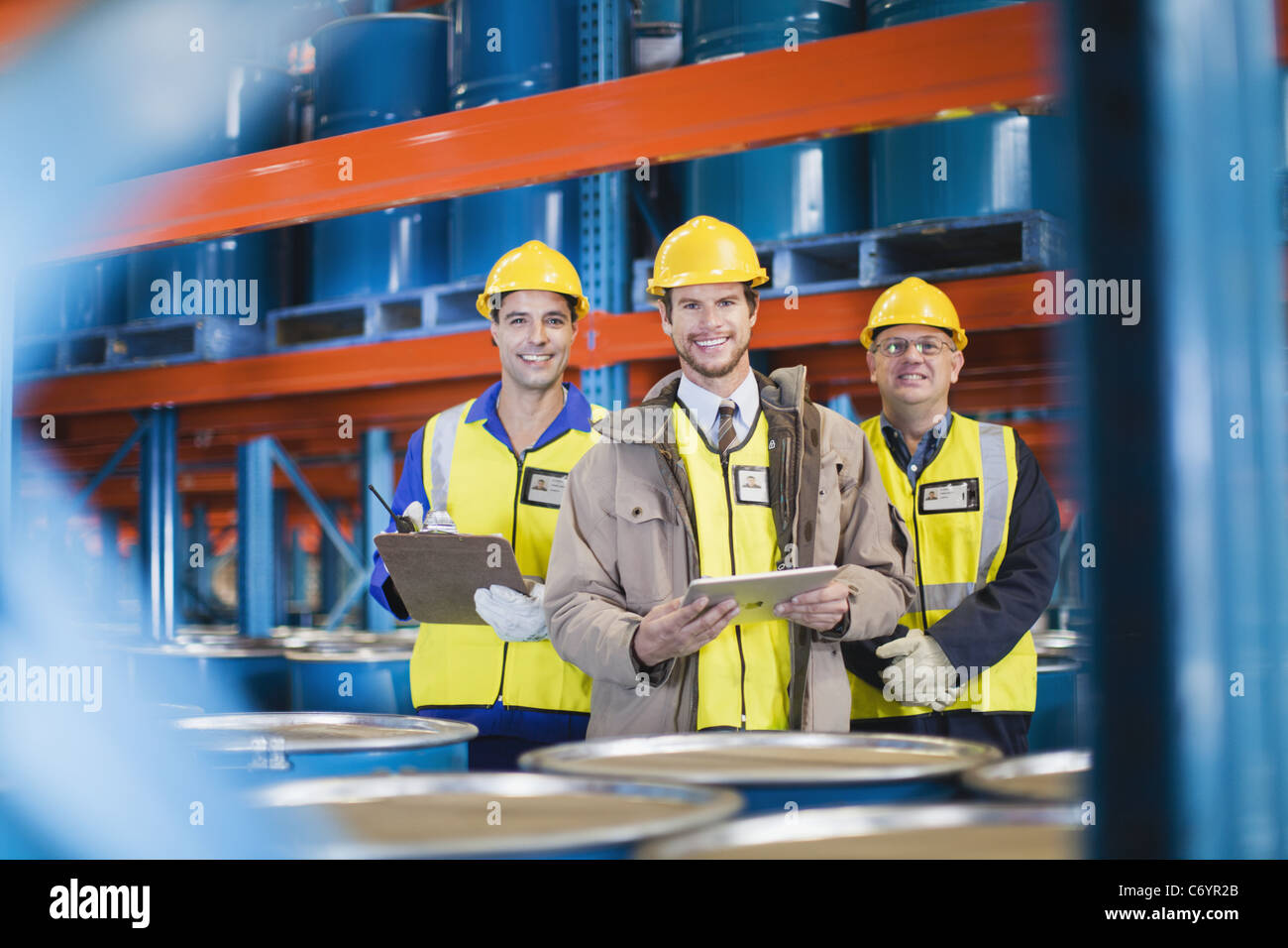 Workers standing in warehouse Stock Photo Alamy