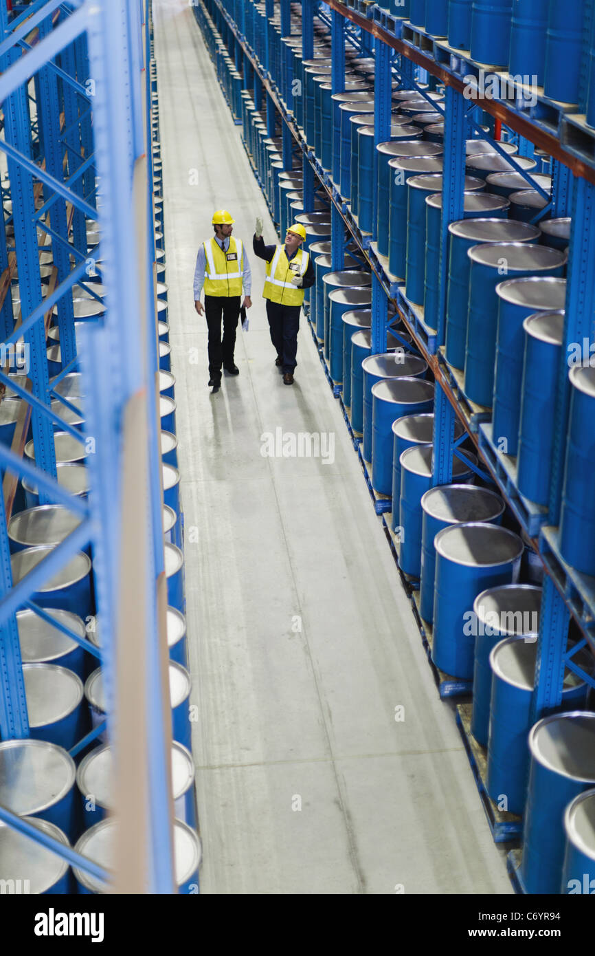 Workers talking in warehouse Stock Photo