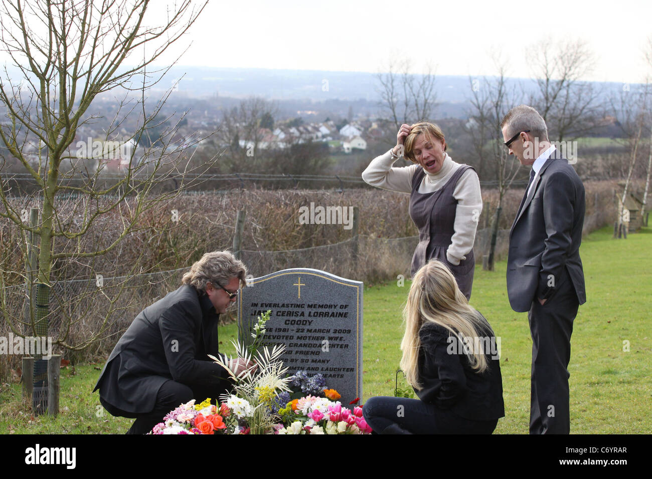 Jade Goody's mum Jackiey Budden, with Mark Fuller, visiting Jade's grave with family and friends after Jade's first anniversary Stock Photo