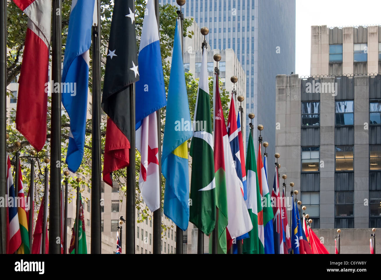 A row of international flags from all over the world in the city of New York. Stock Photo