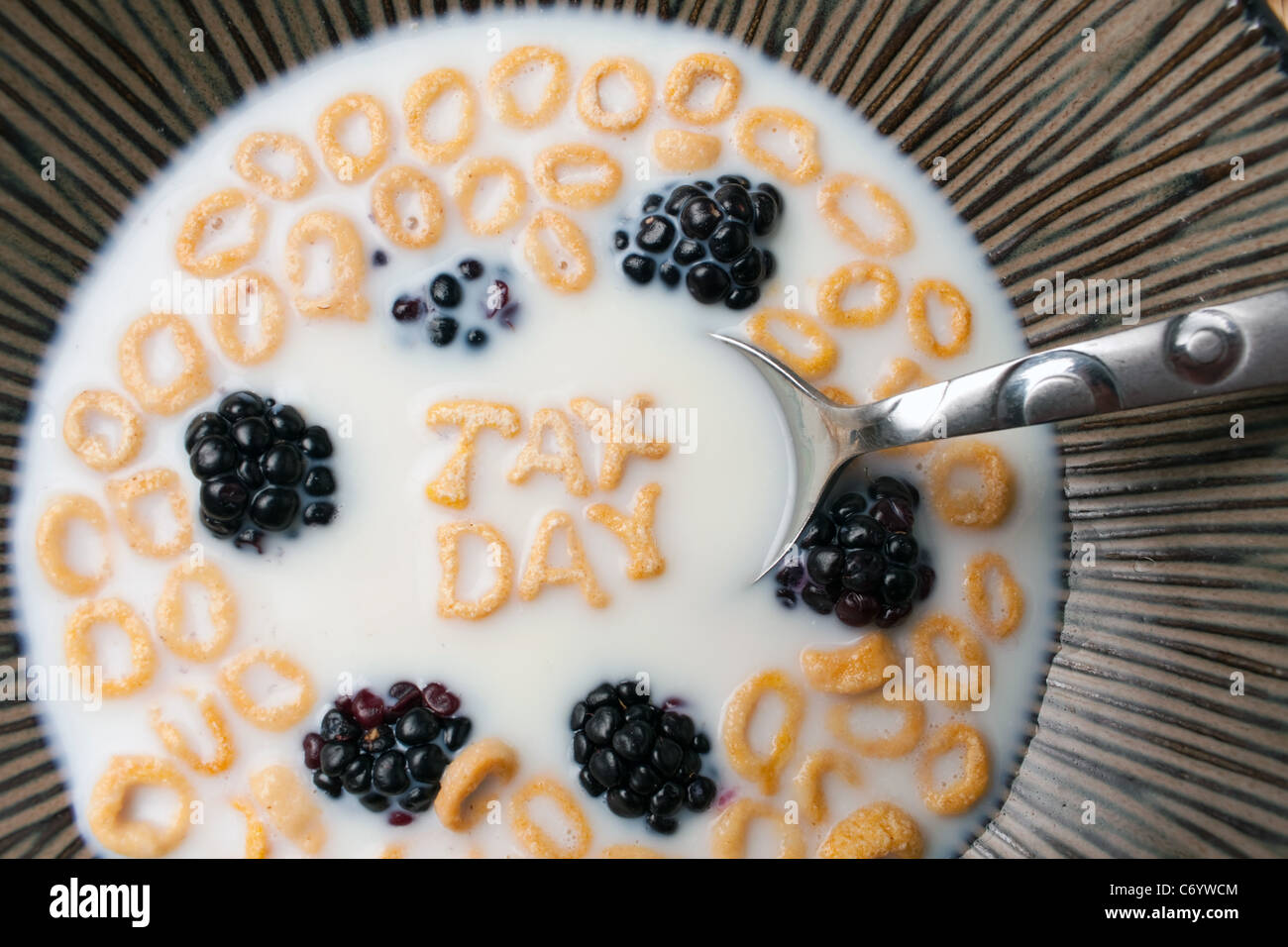 The words TAX DAY spelled out of letter shaped cereal pieces floating