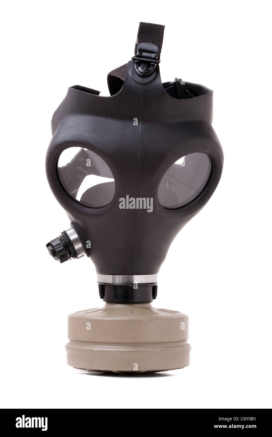 An old worn gas mask with black rubber isolated on white. Stock Photo
