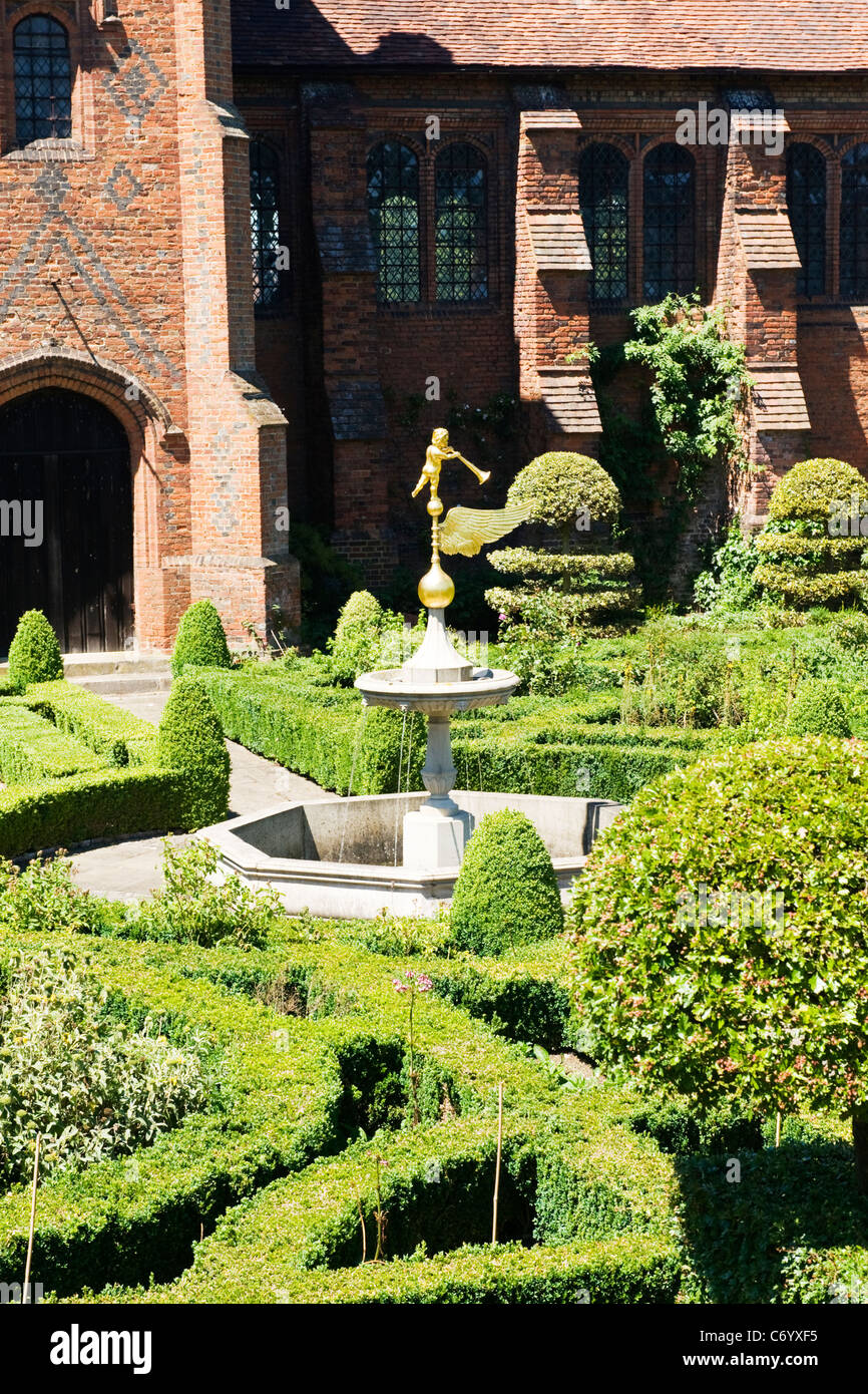 Hatfield House , rear entrance & stairs to The Old Palace & Garden detail with gold statue & fountain Stock Photo