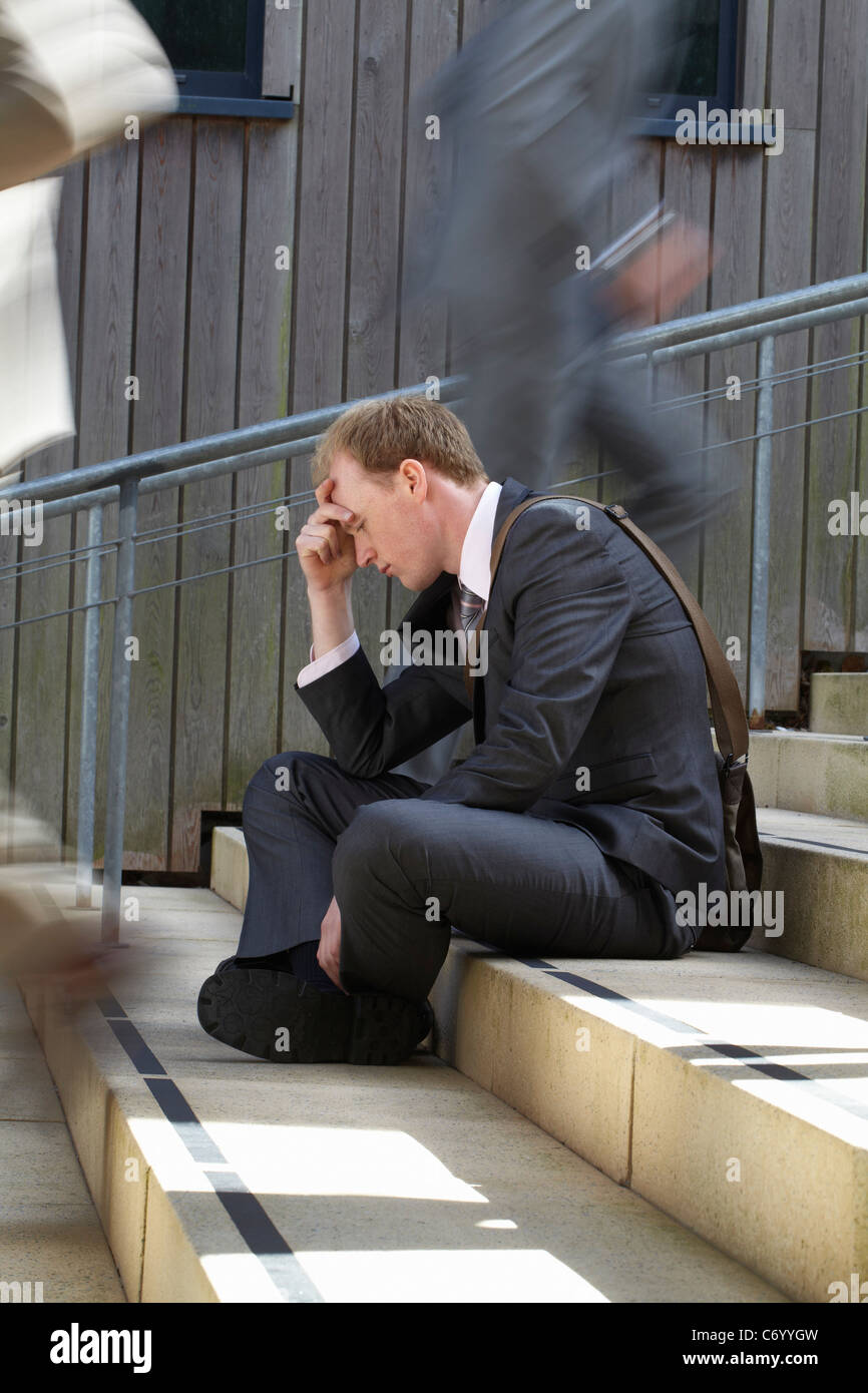 Time lapse view of depressed businessman Stock Photo