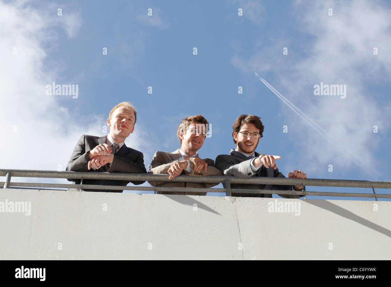 Businessmen standing on walkway Stock Photo