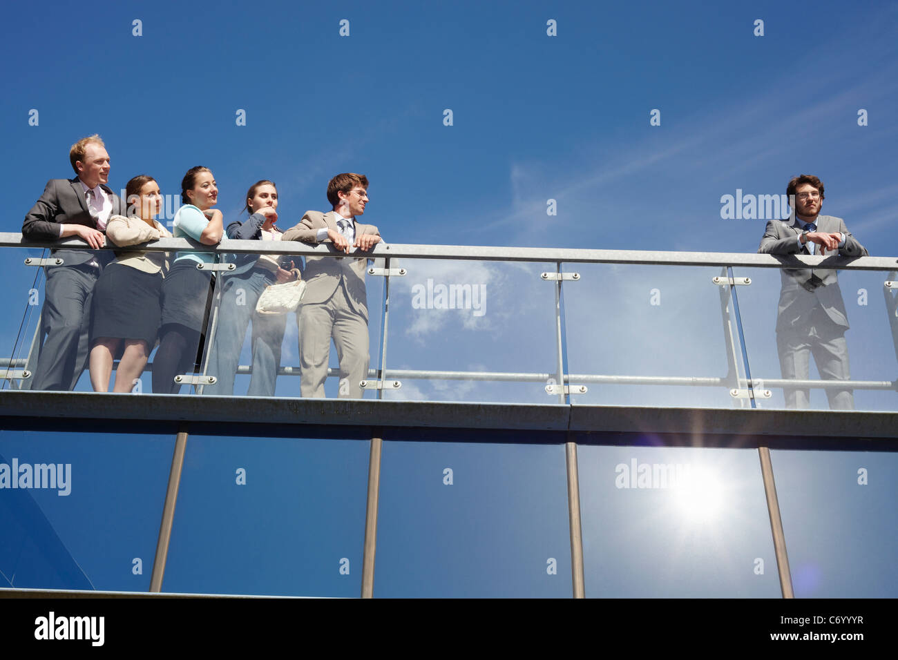 Business people standing on walkway Stock Photo