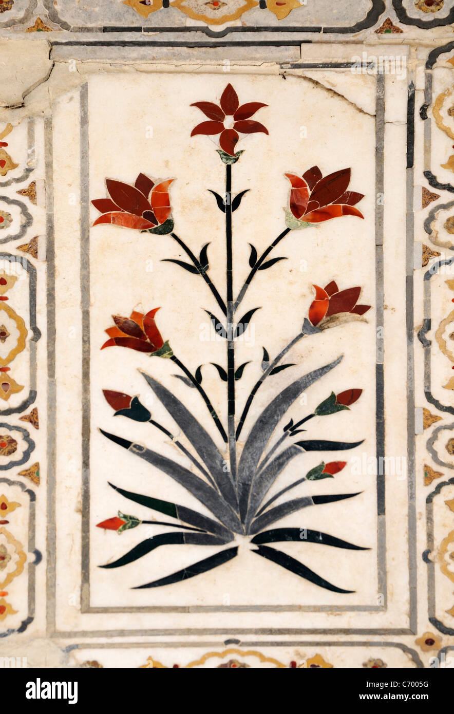 A flowering plant made from  semi precious stones inlaid in white marble.   Agra Fort  . Agra, Uttar Pradesh, Republic of  India Stock Photo