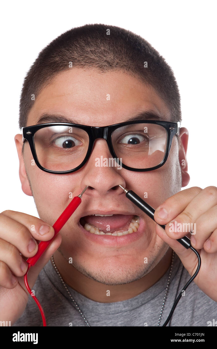 A goofy man wearing trendy nerd glasses isolated over white with a funny expression on his face. Stock Photo