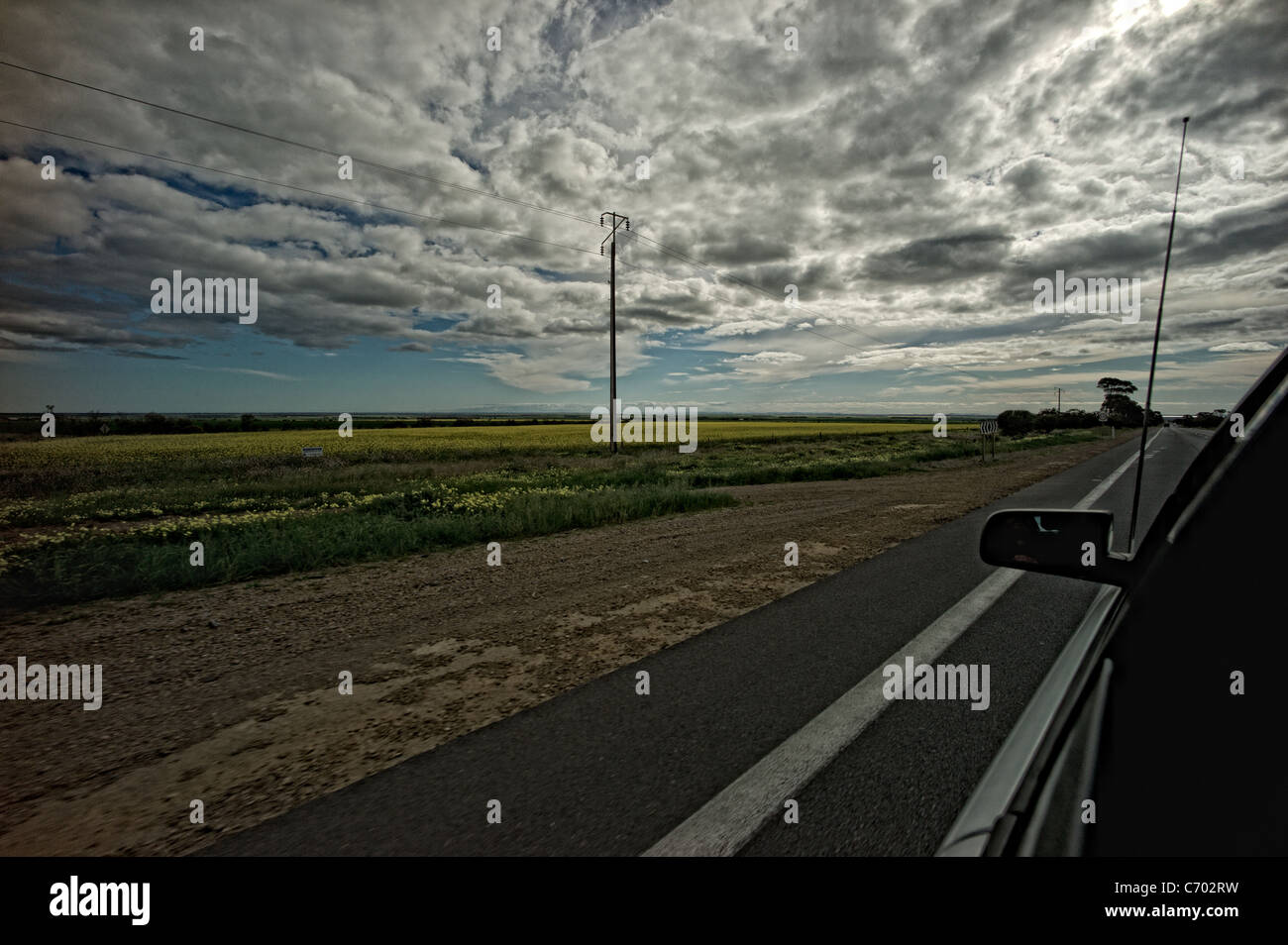 Scene from Car window of Expansive countryside. Blue Skies with clouds ...