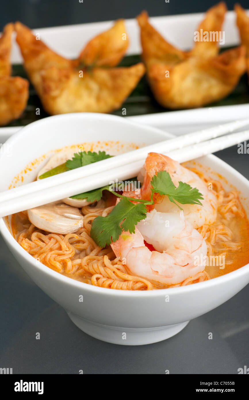 Shrimp and Thai noodle soup bowl with chopsticks along with fried