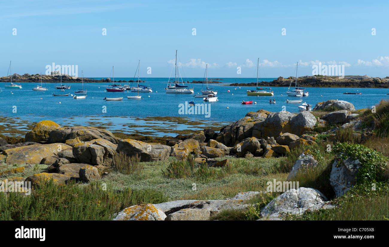 Boats on moorings in the rock strewn Iles Chausey, a picturesque destination off the coast of Normandy, France. Stock Photo