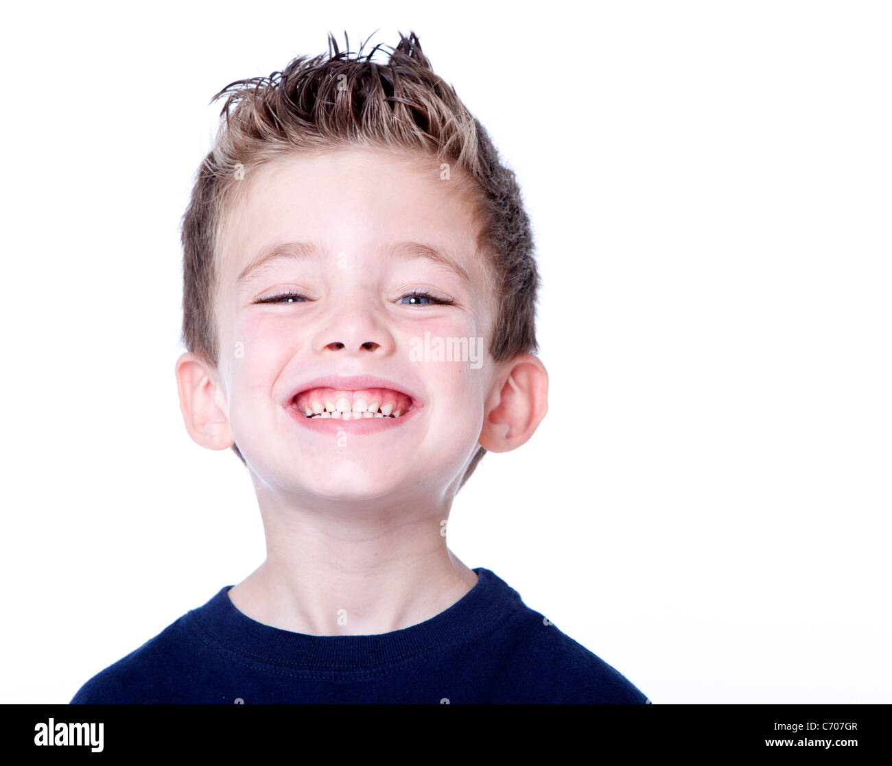 Happy young boy with smile on his face on white Stock Photo - Alamy