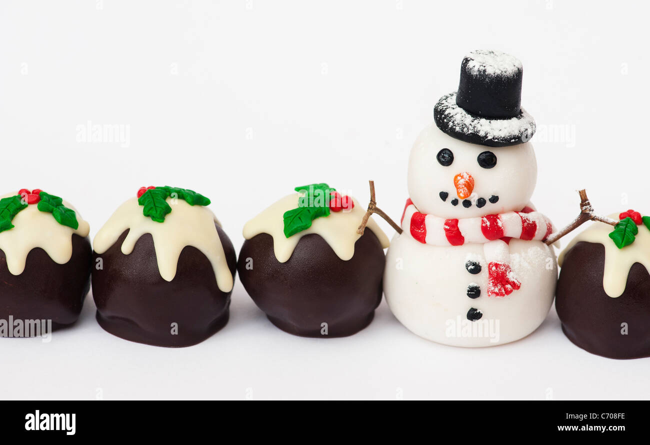 Homemade Christmas pudding chocolates and fondant icing snowman Stock Photo