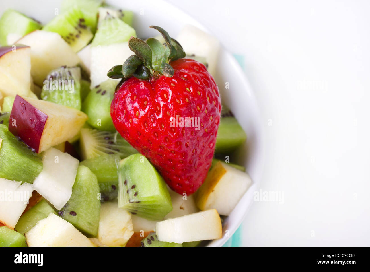 Fruit salad in white plate, closeup Stock Photo