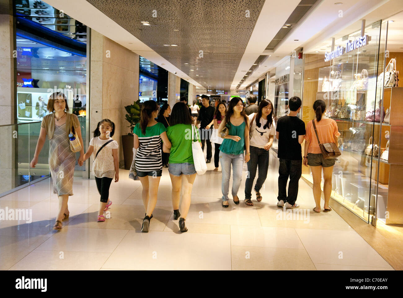 Asian shoppers in the Ion Shopping Mall, Singapore Asia Stock Photo