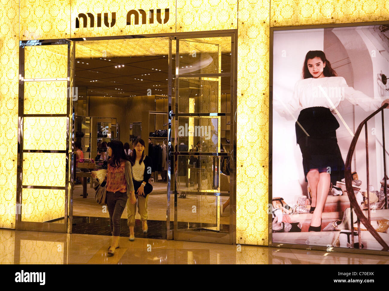 Customers at the entrance to the Miu Miu fashion store, the Ion shopping Mall, Singapore asia Stock Photo