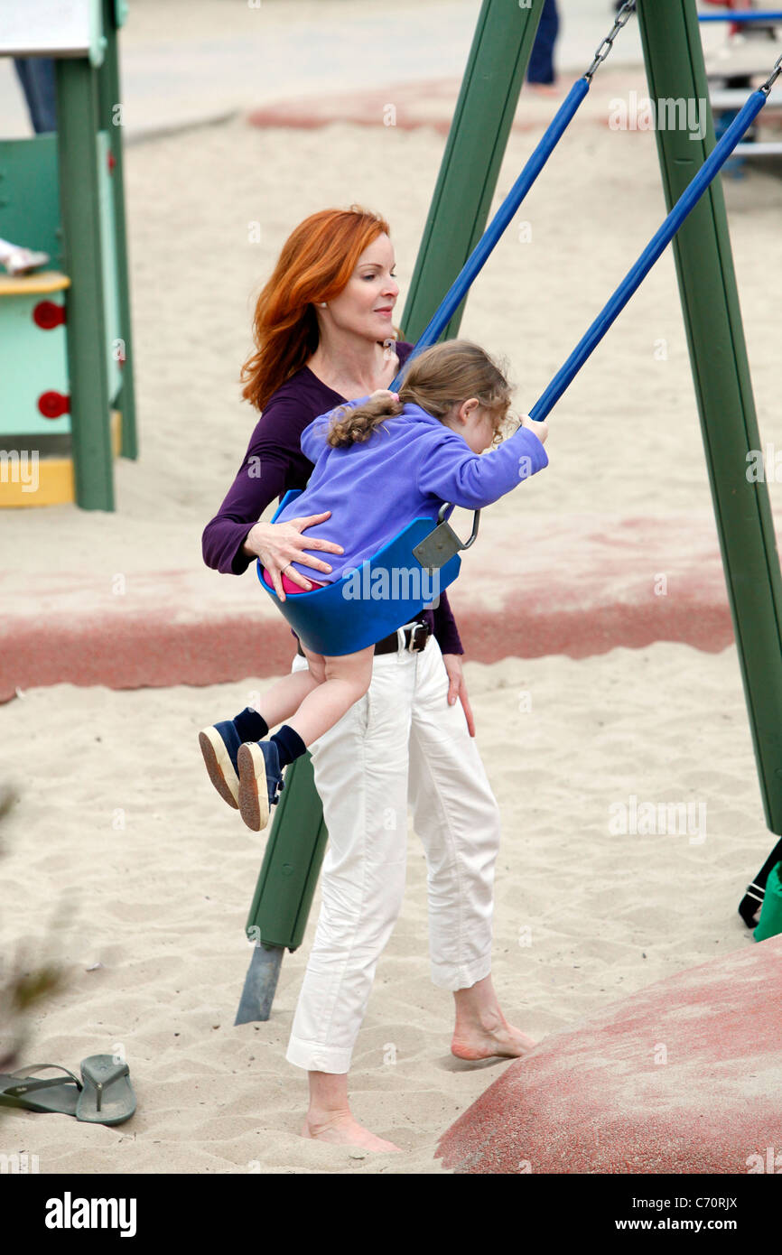 Marcia Cross plays with her twin daughters Eden and Savannah to a