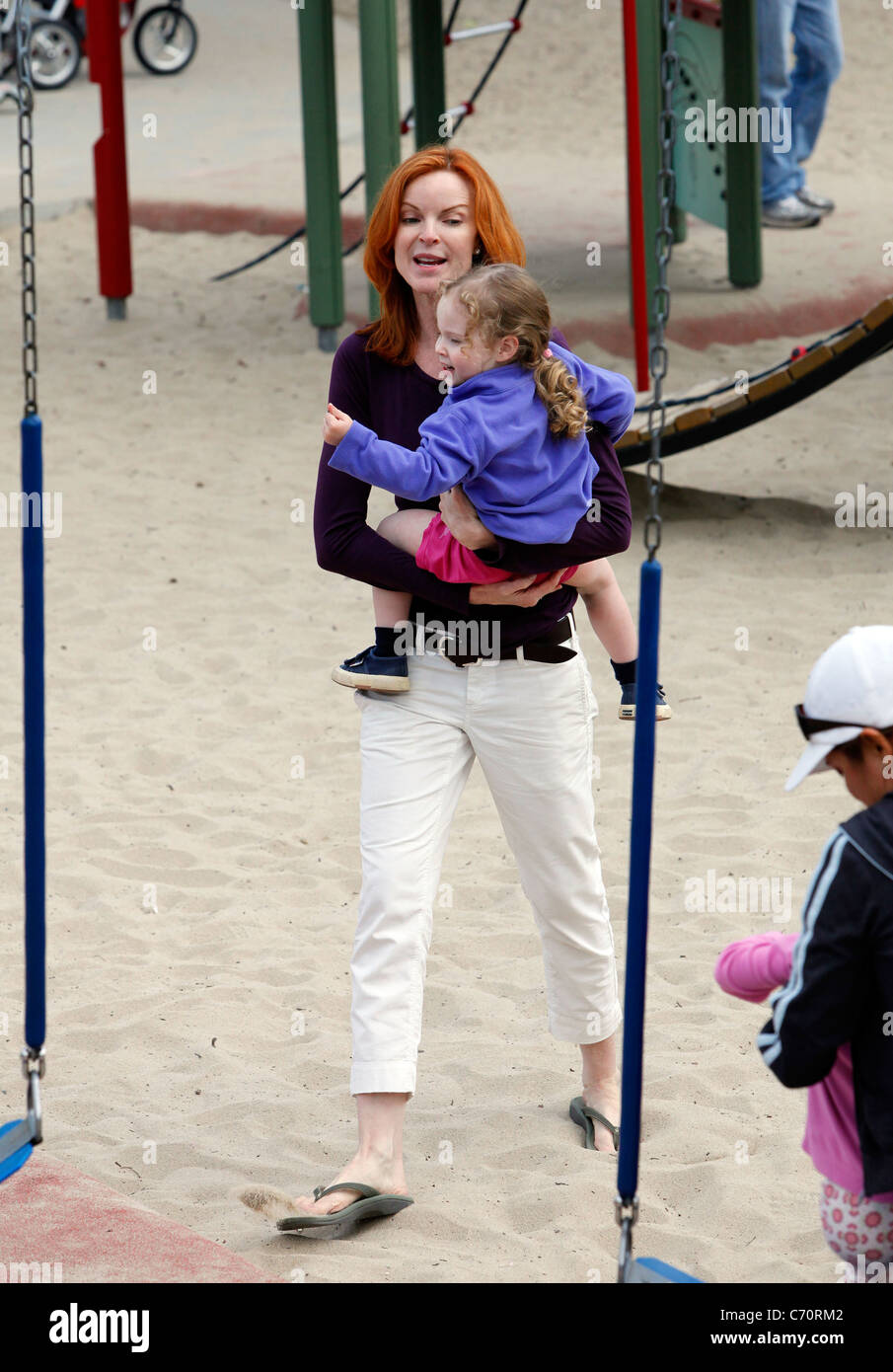 Marcia Cross takes her twin daughters Eden and Savannah to a playground