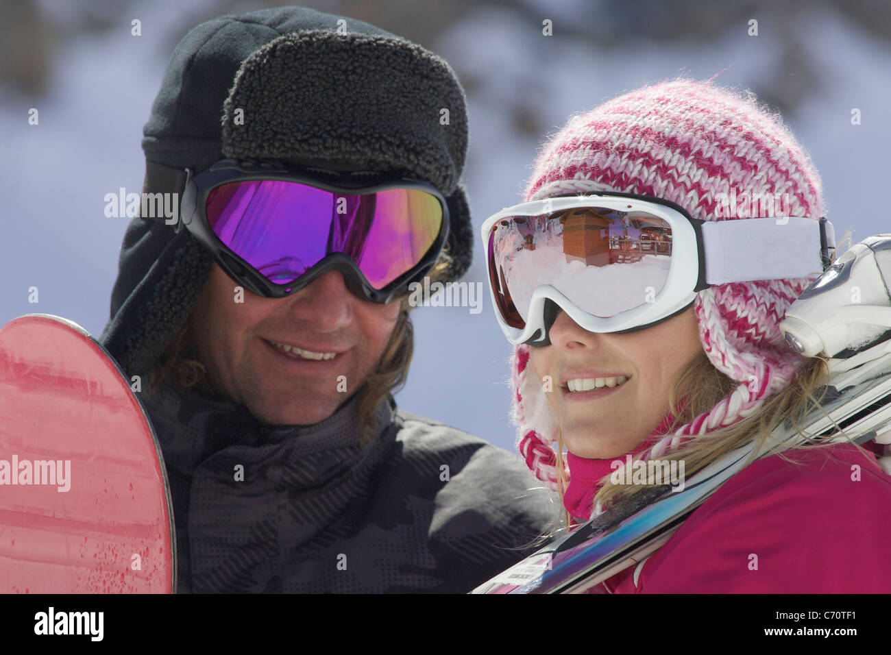 Smiling couple wearing ski goggles Stock Photo