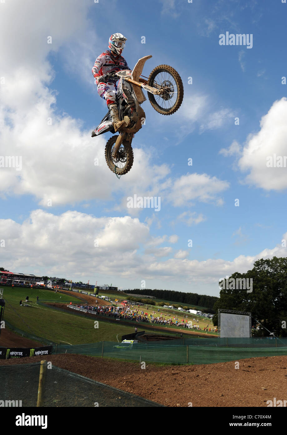 A Motocross Rider jumps through the air on an MX Bike Stock Photo Alamy