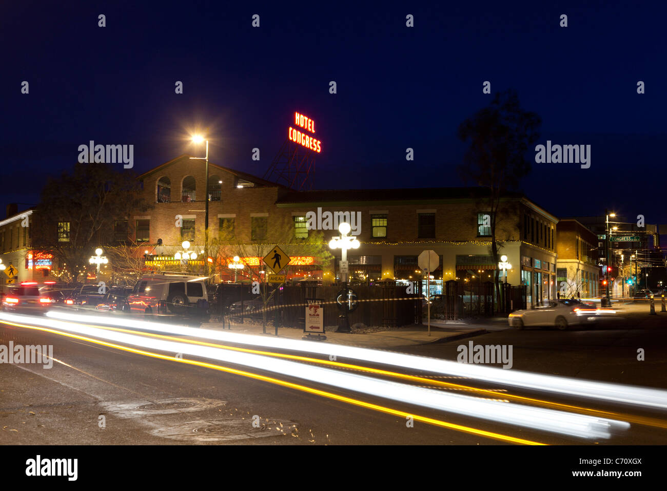Cars driving past the Hotel Congress in Tucson, AZ at night. Stock Photo
