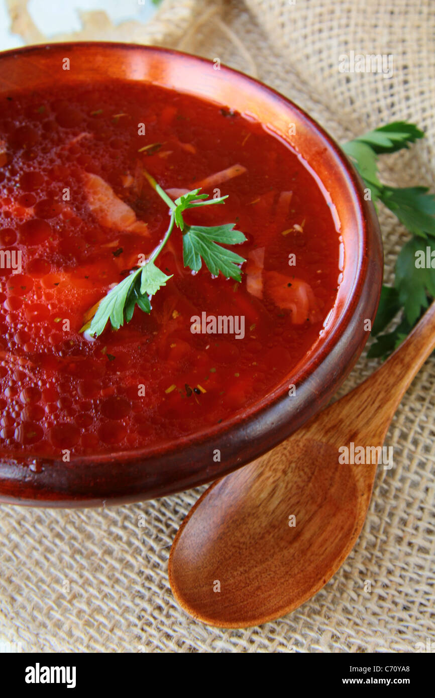 traditional Russian ukrainian borscht soup at a wooden table Stock Photo