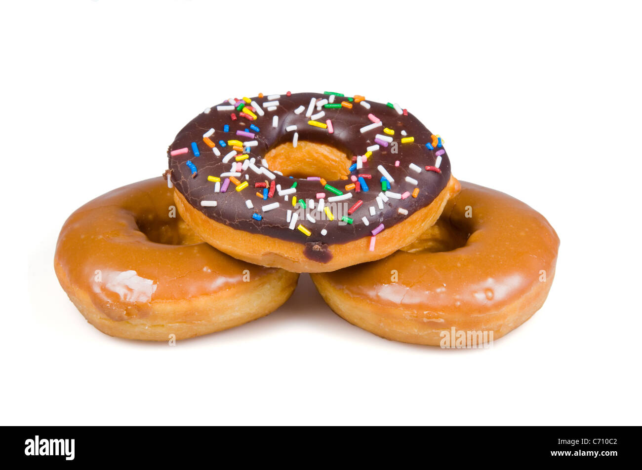 Three colorful sweet doughnuts on white background Stock Photo - Alamy