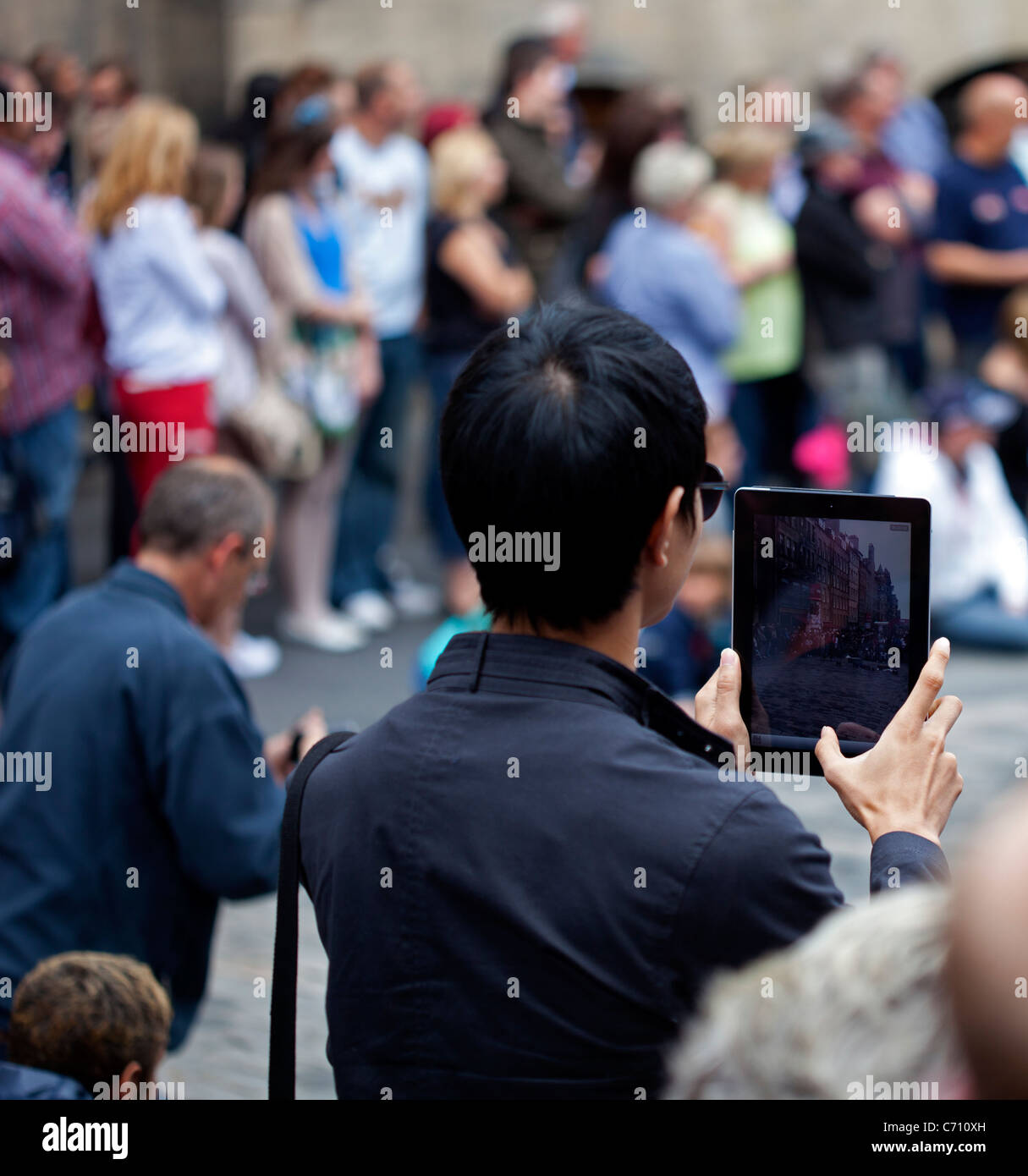 Man taking photograph with a tablet Edinburgh Scotland UK Europe Stock Photo