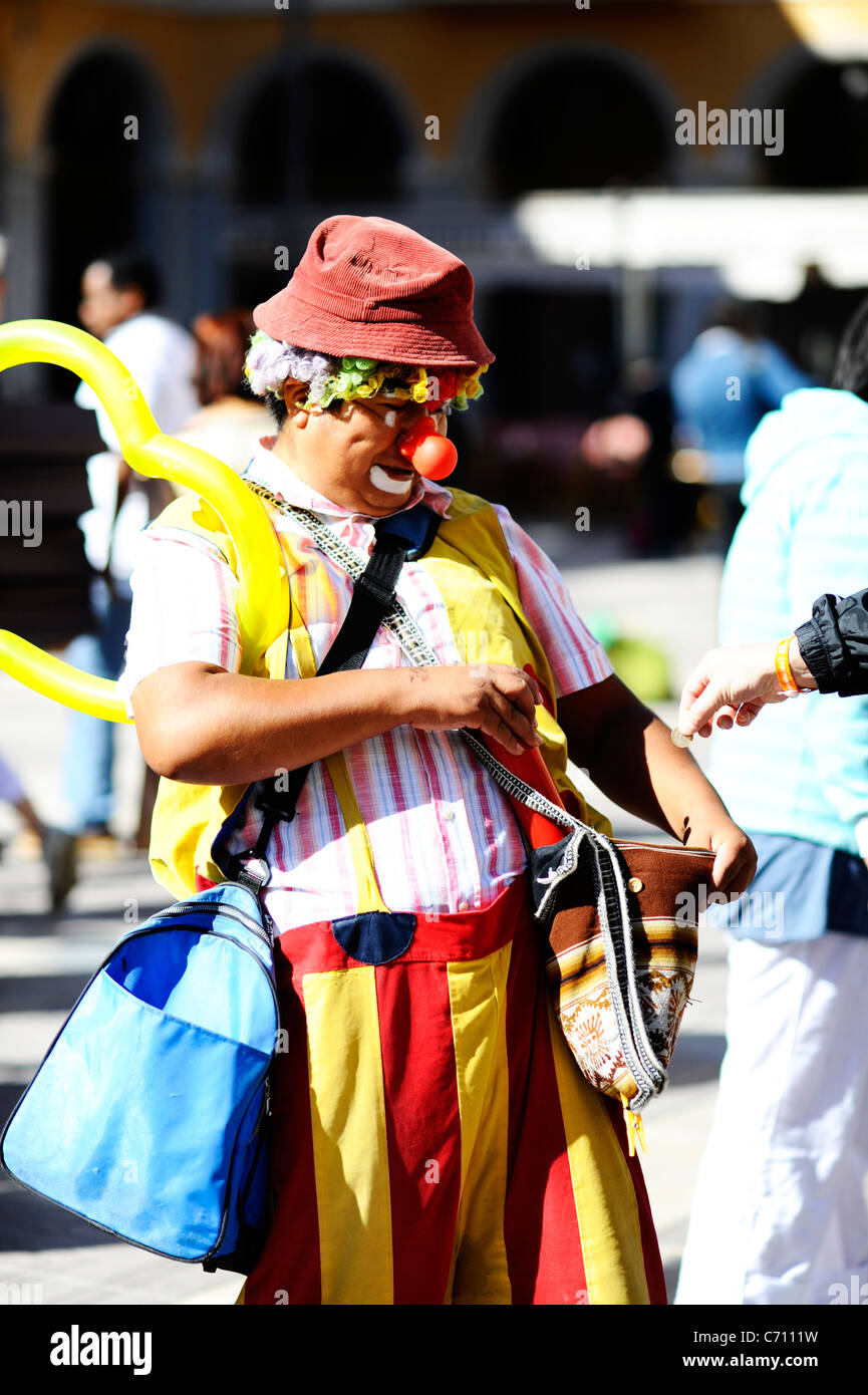 A clown taking money in Palma, Mallorca Stock Photo