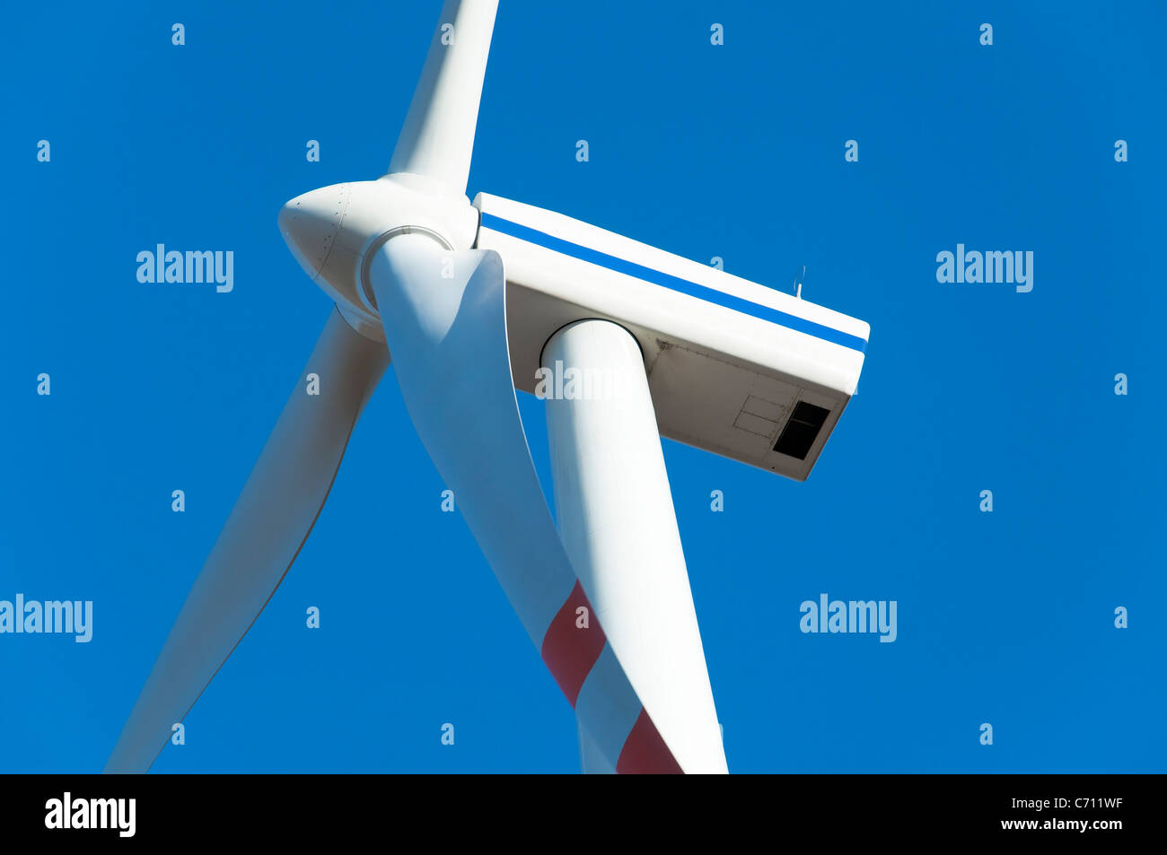 Wind turbine against blue sky Stock Photo - Alamy