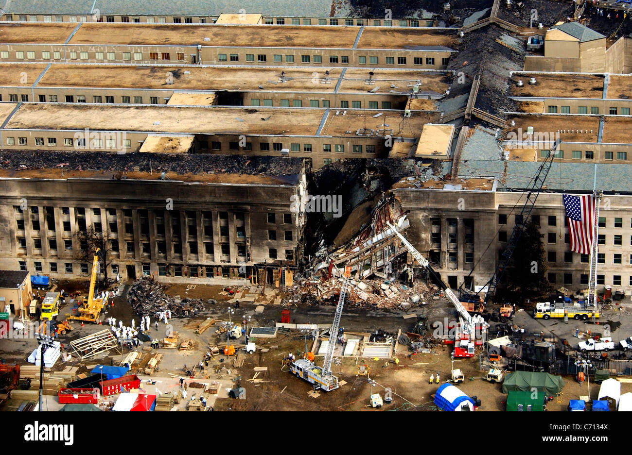Aerial view of the Pentagon Building located in Washington, District of Columbia (DC), showing emergency crews responding to the destruction caused when a high-jacked commercial jetliner crashed into the southwest corner of the building, during the 9/11 terrorists attacks. Stock Photo