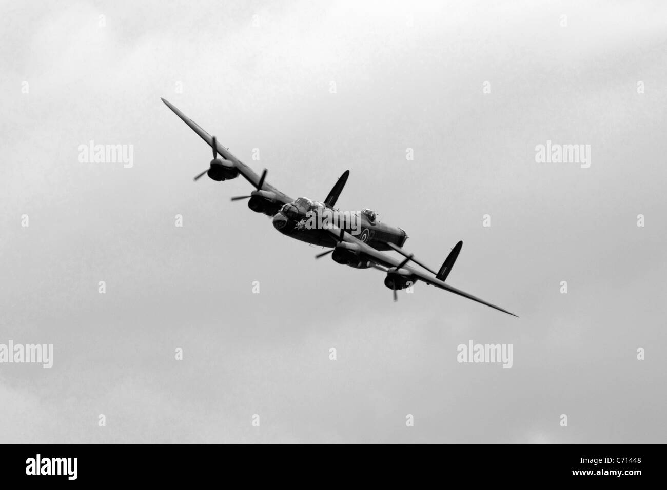 Bw Ww2 British Raf Avro Lancaster Bomber Plane On A Pass Over An