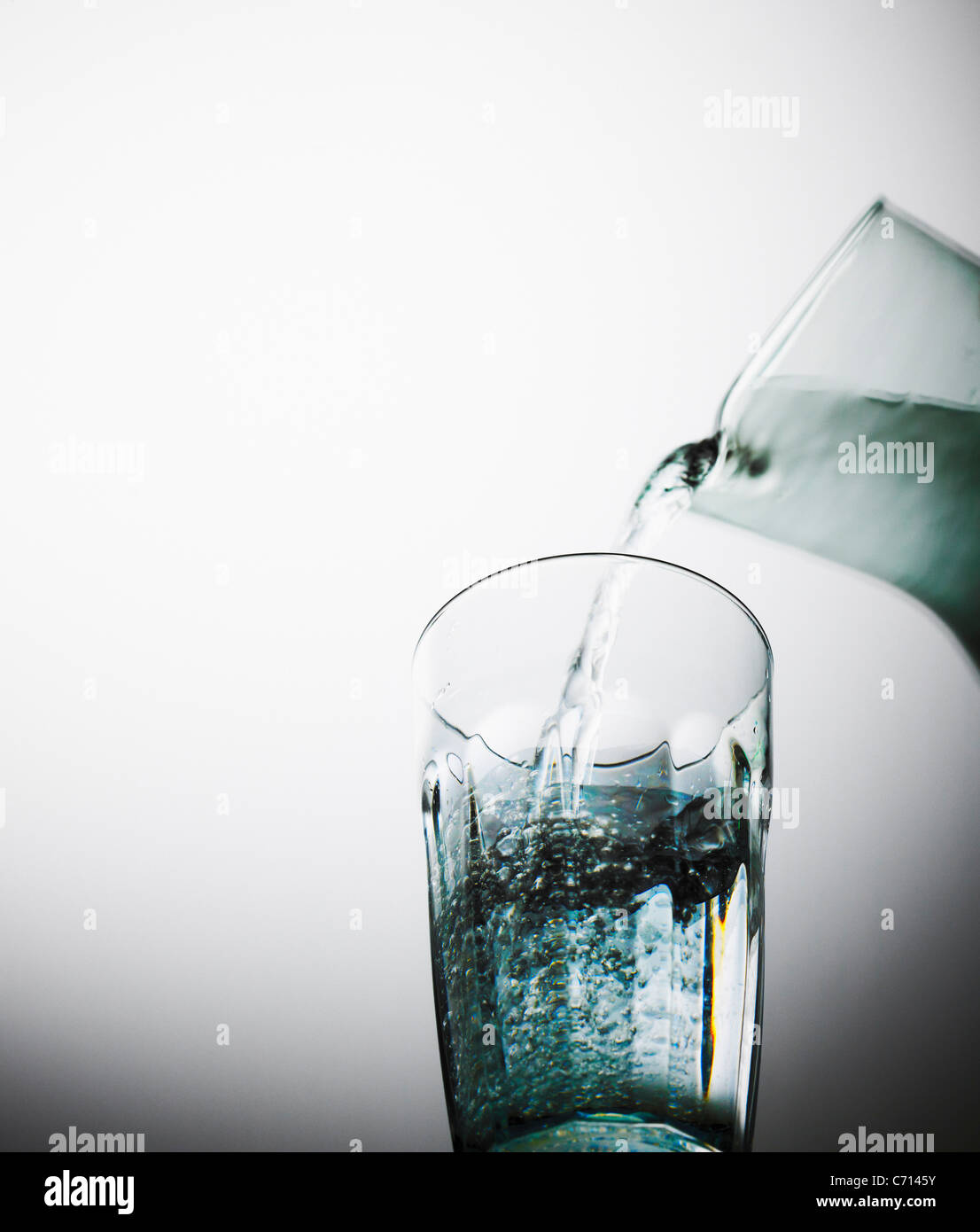 water being poured from a jug into a glass Stock Photo Alamy