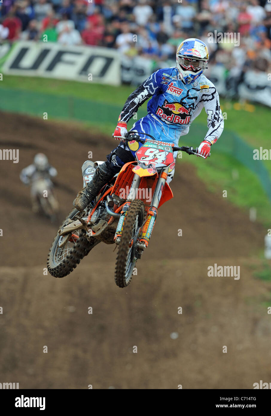 A Motocross Rider jumps through the air on an MX Bike Stock Photo Alamy