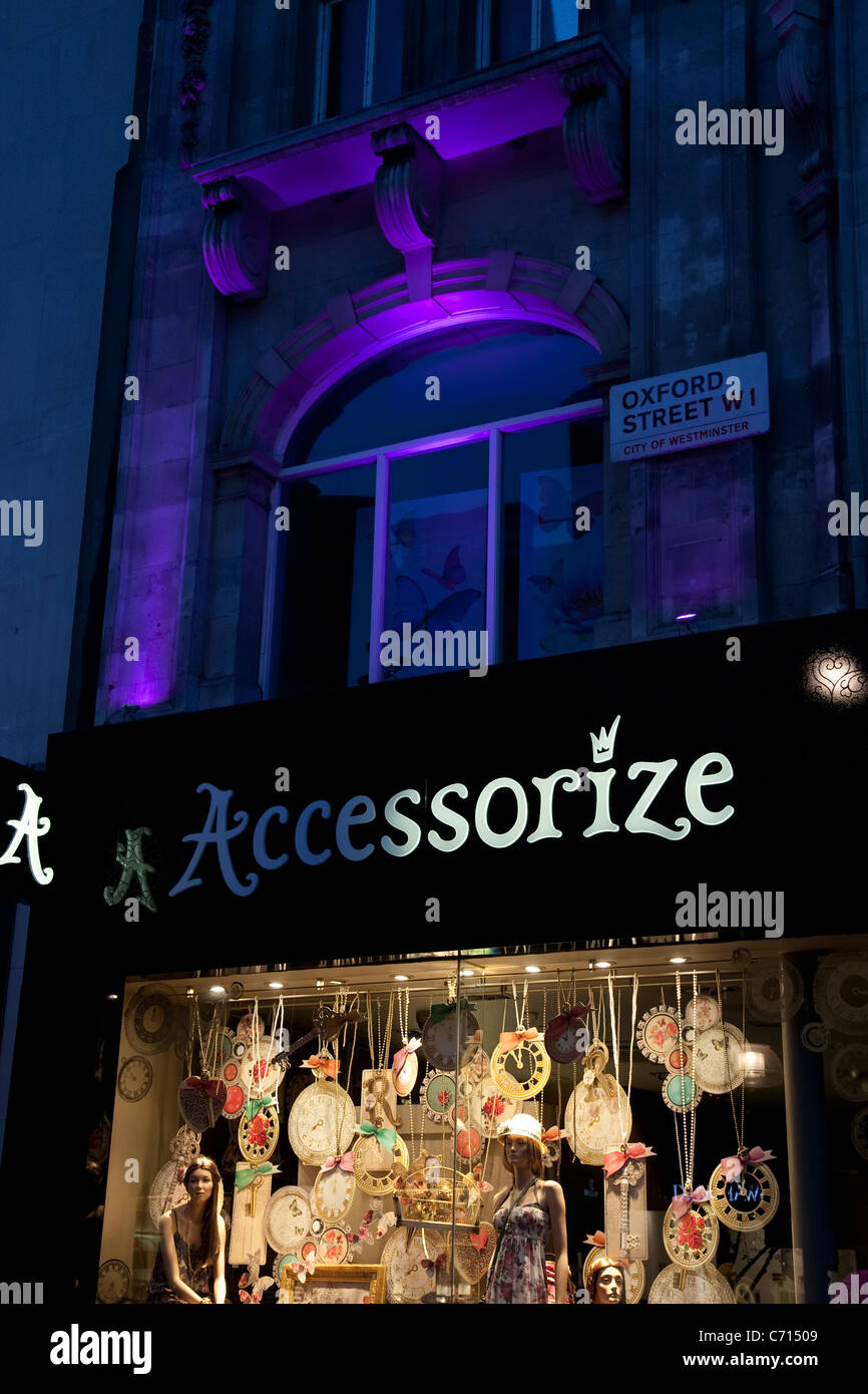 Accessorize Shop on Oxford Street, West End illuminated at night, London,  England, UK Stock Photo - Alamy