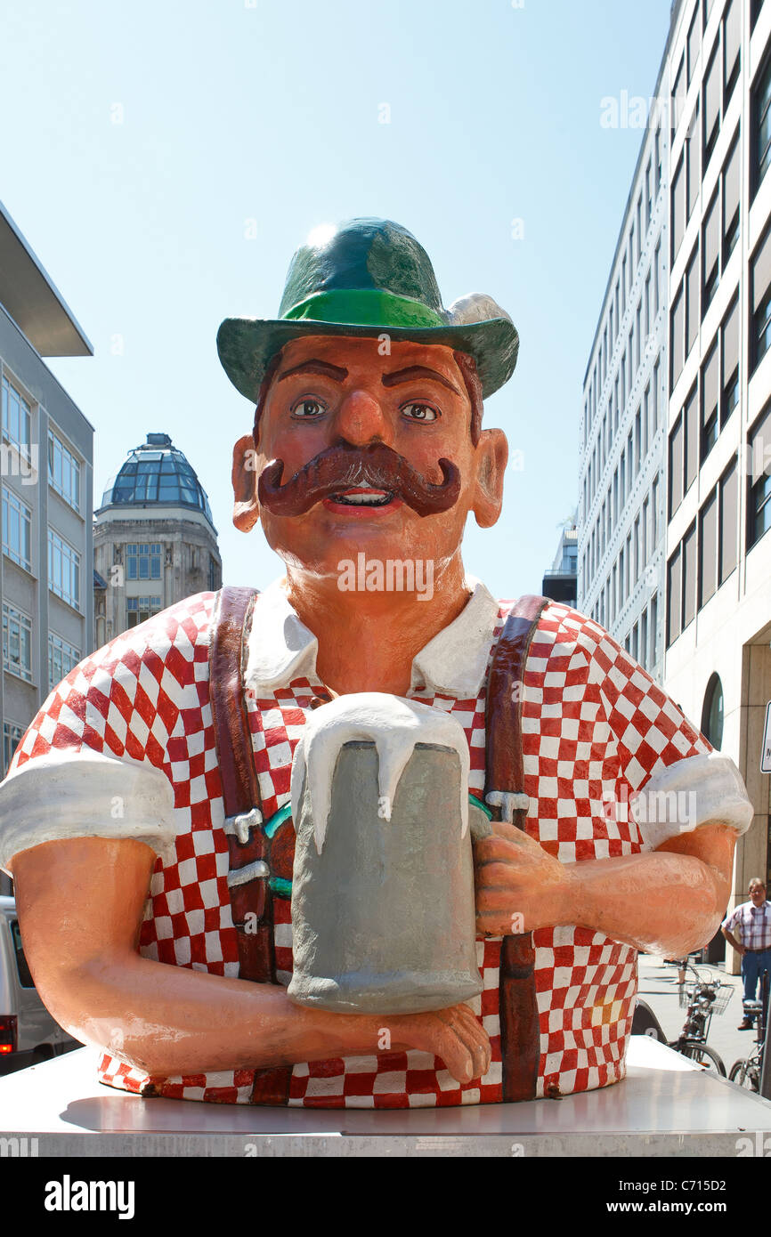 figure image traditional german beer stein advert man holding beer mug hat mustache Stock Photo
