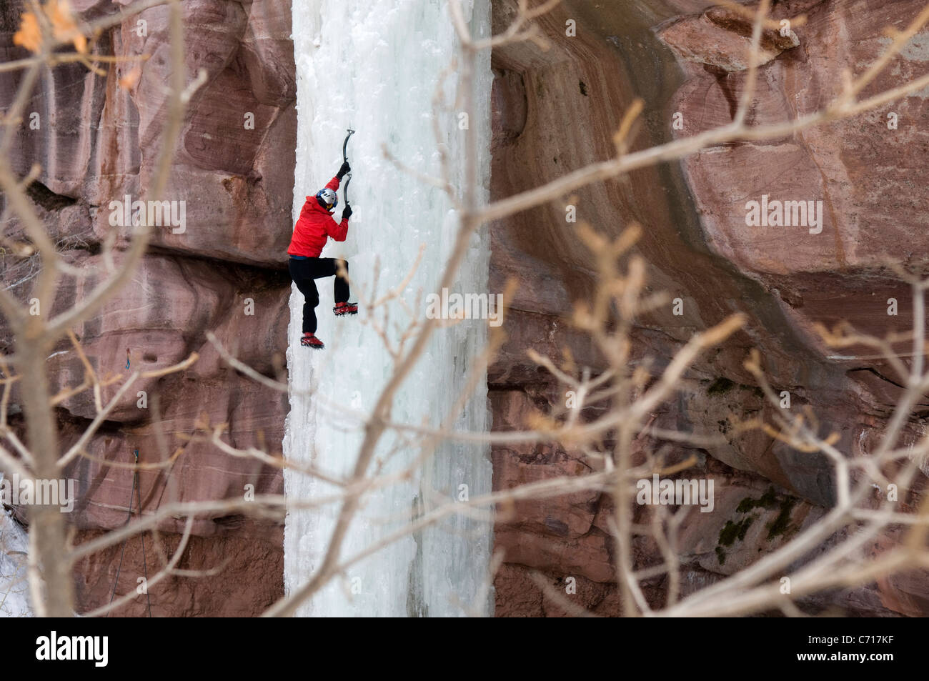Man climbing ice pillar without a rope, Redstone, Colorado Stock Photo