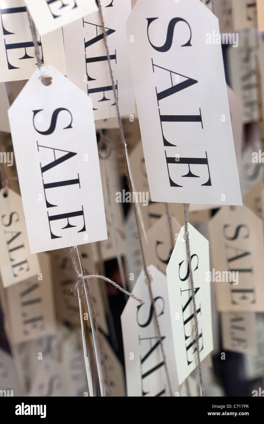 Sale labels in shop window Stock Photo - Alamy
