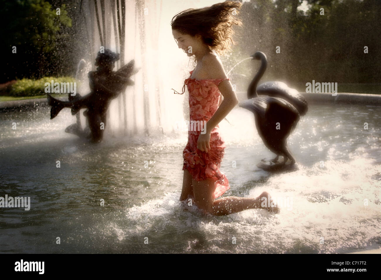 Girl playing in fountain Stock Photo - Alamy